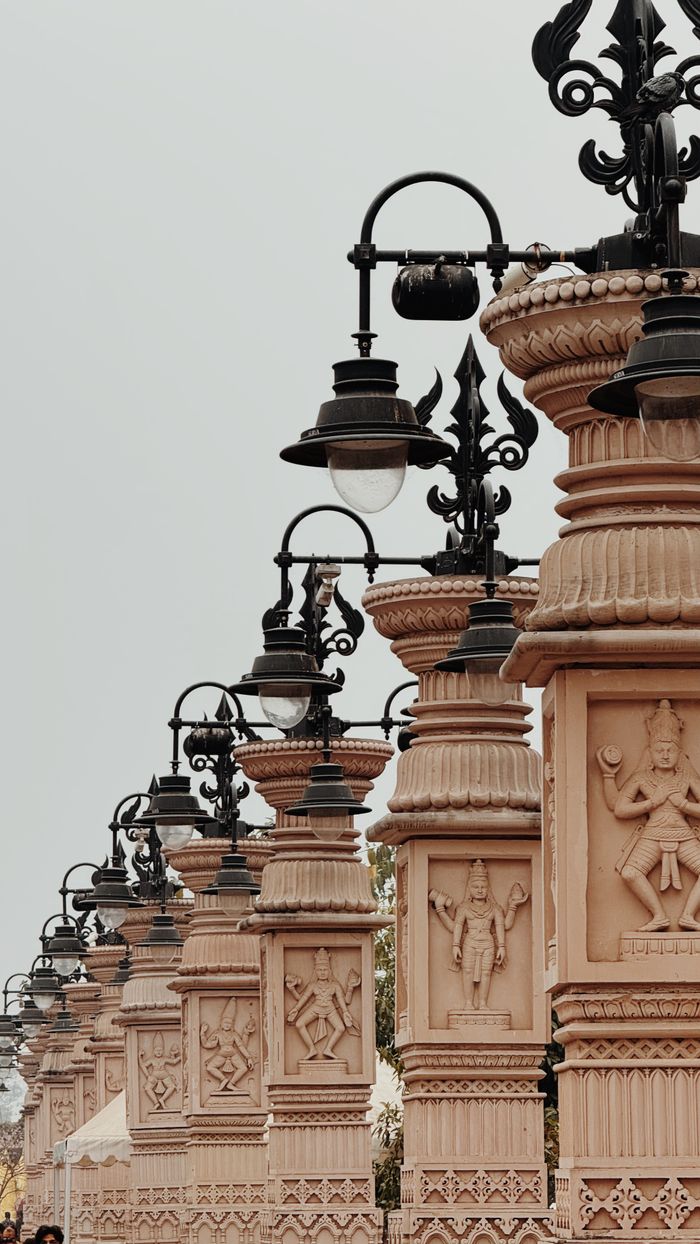Row of intricately designed street lamps in Ujjain, showcasing traditional architectural elements.